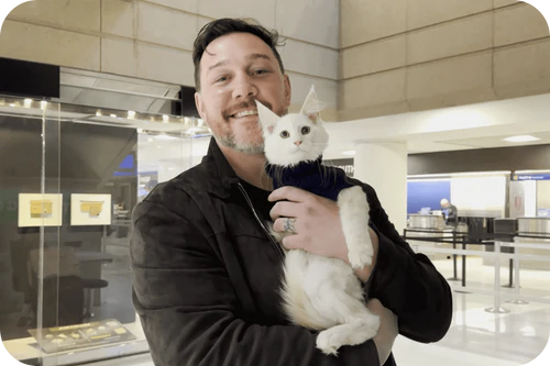 Happy family with their Cavalier puppy