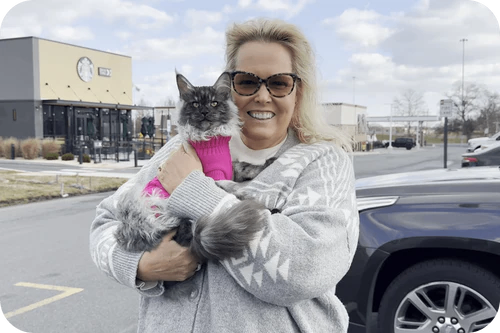 Happy family with their Cavalier puppy