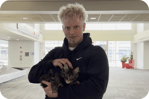 Happy family with their Cavalier puppy