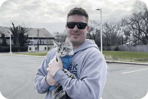 Happy family with their Cavalier puppy