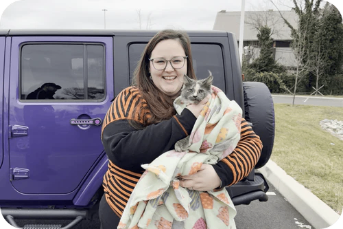Happy family with their Cavalier puppy
