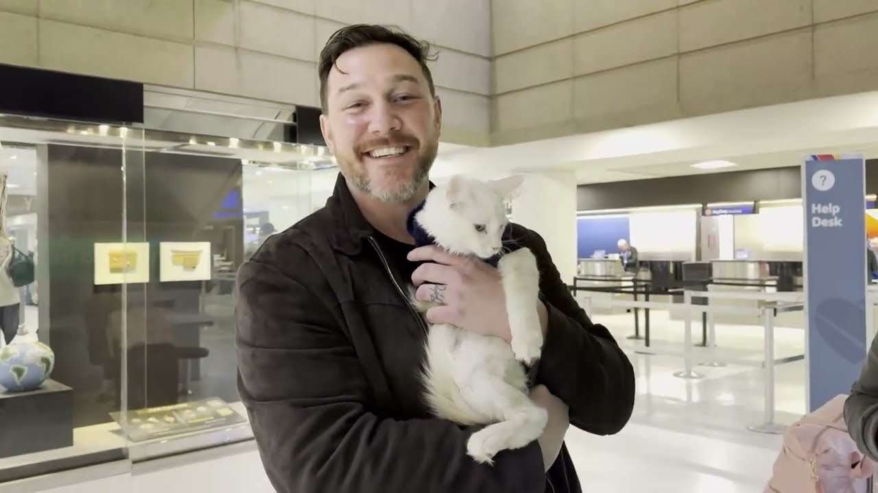 Happy family with their Cavalier puppy