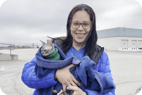 Happy family with their Cavalier puppy