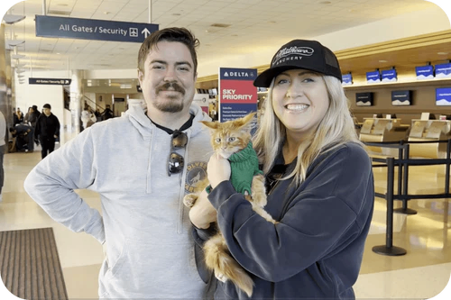 Happy family with their Cavalier puppy
