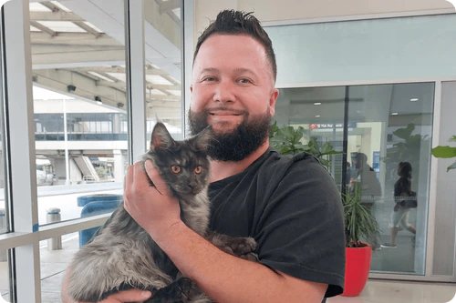 Happy family with their Cavalier puppy