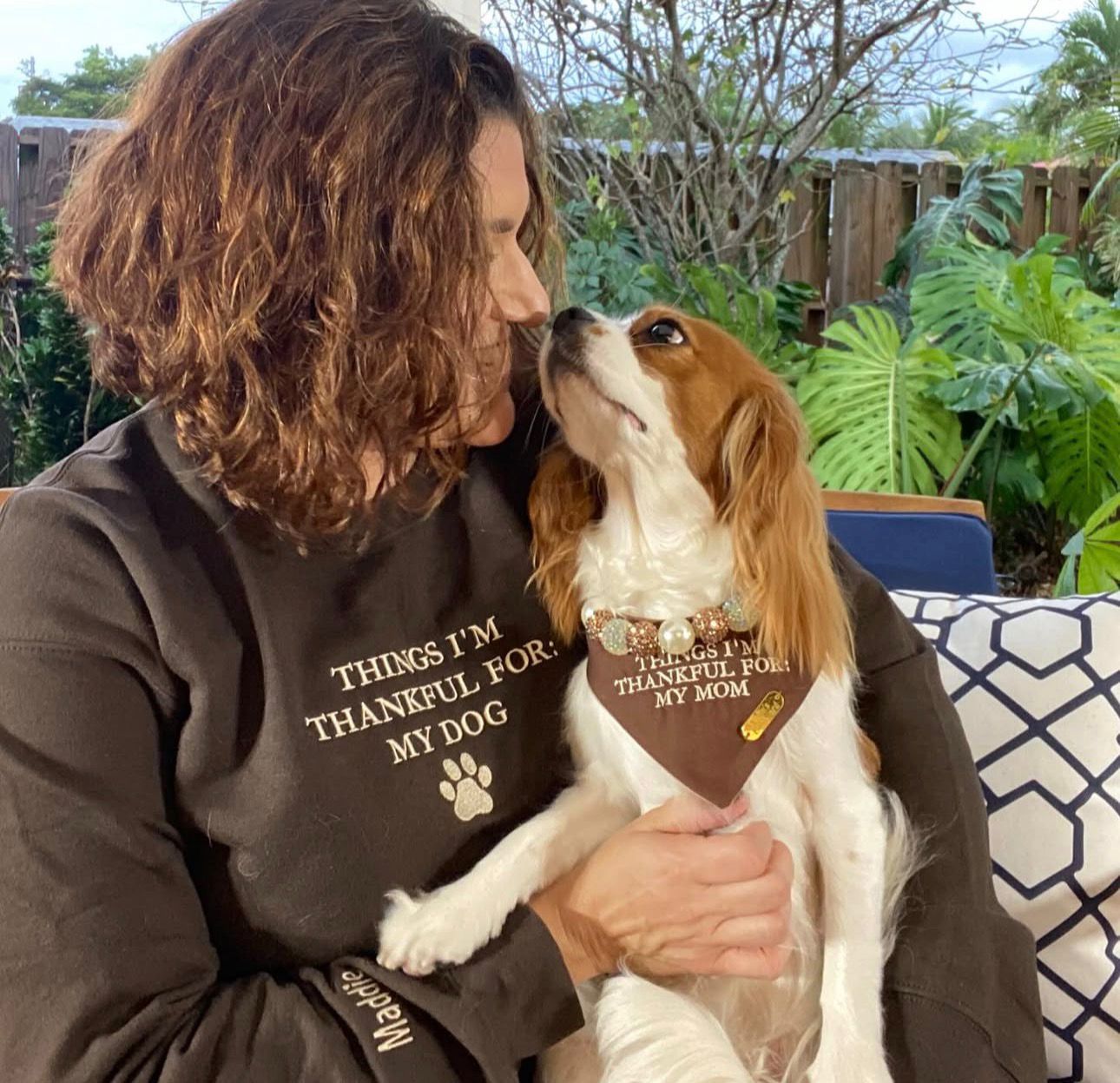 Happy family with their Cavalier puppy