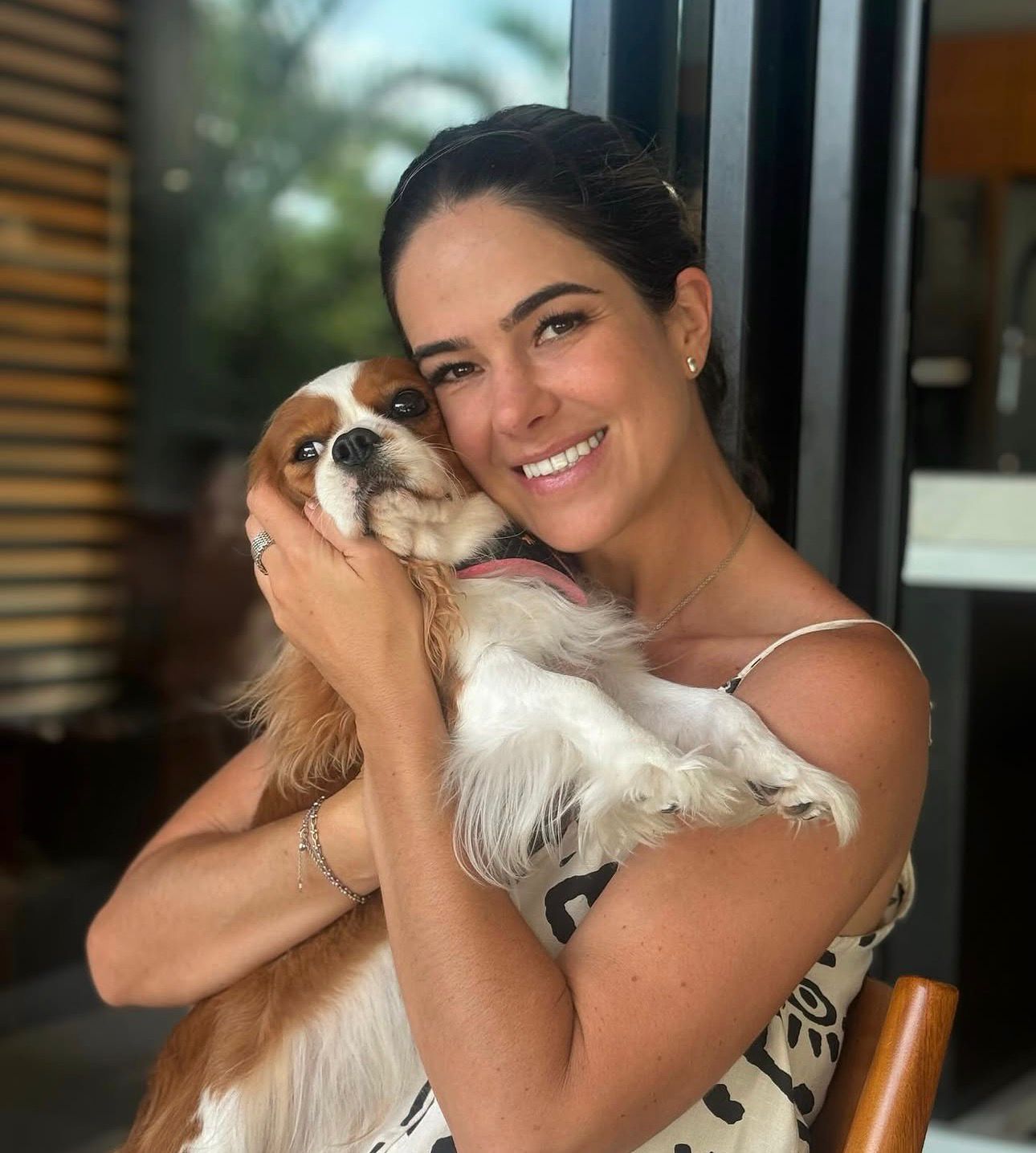 Happy family with their Cavalier puppy