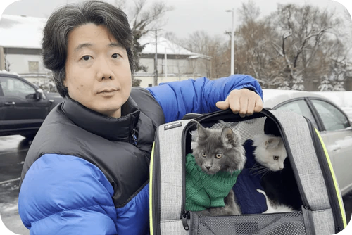 Happy family with their Cavalier puppy